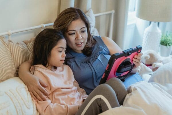 A mother talking to her daughter baout creating a digital family agreement