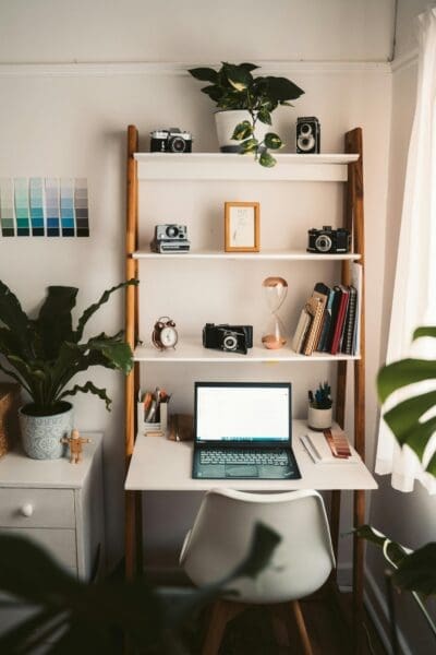 Use vertical space by installing shelves or pegboards to store office supplies and personal items.