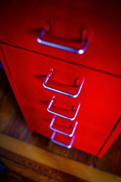 Efficient storage is vital in a shared home office for two to make the most of limited space.