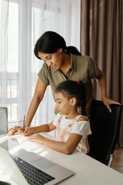 Digital Parenting Tips Parents and children using technology together, illustrating digital parenting tips for screen time management and online safety.