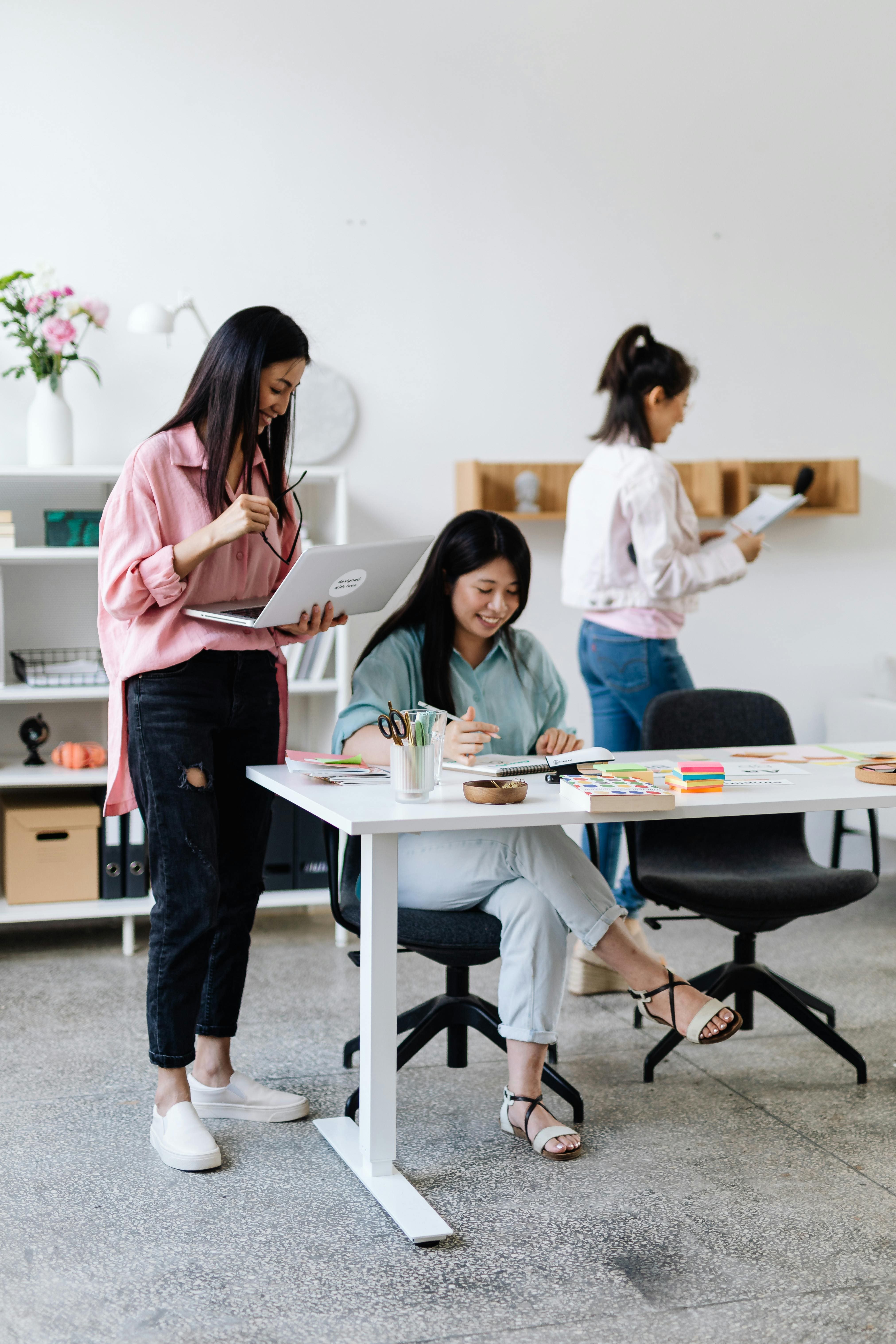 Team collaborating in a modern digital workspace, reflecting strong workplace culture and technology-driven collaboration