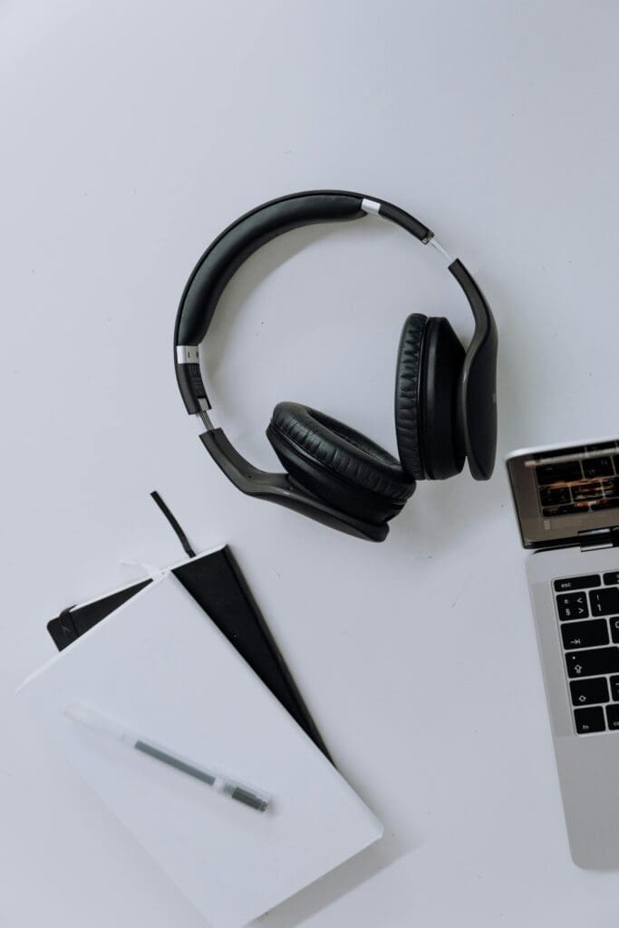 Sony WH-CH520 headphones on modern desk next to a laptop